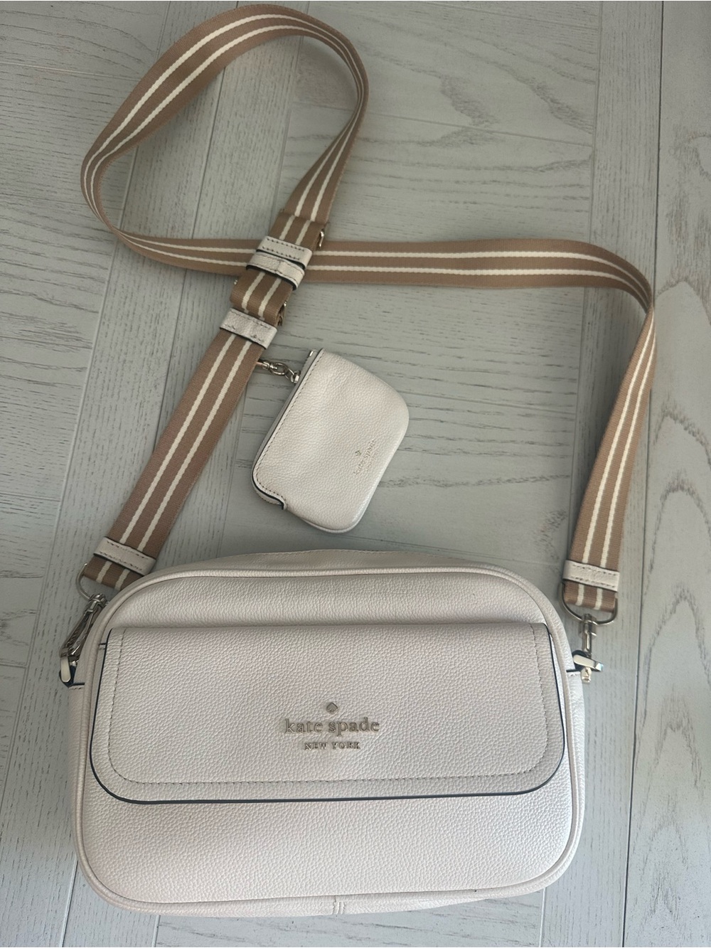 kate spade cream pebbled leather crossbody with tan striped strap
